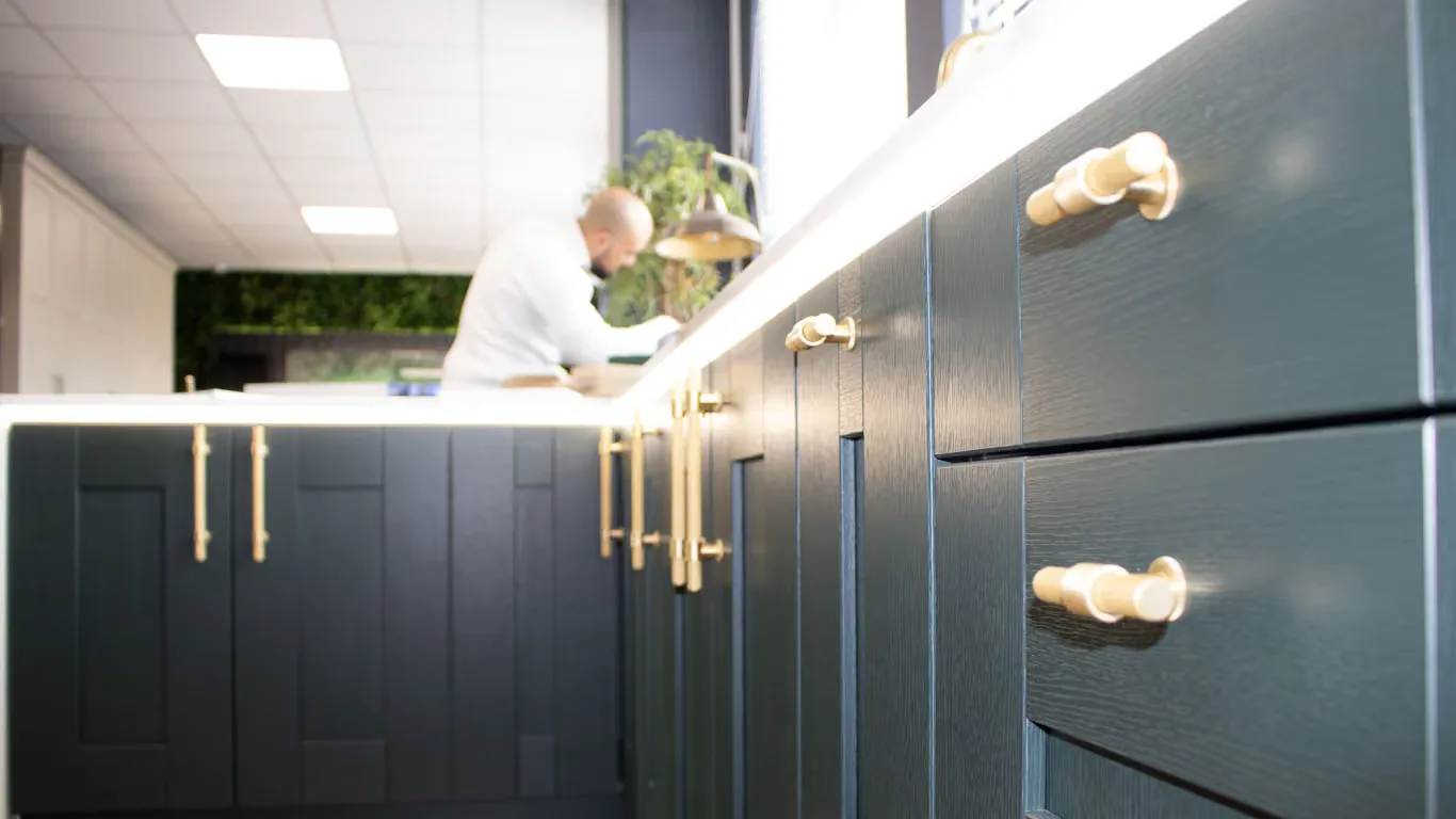 The Bespoke Bedrooms building in Stirchley: sprayed doors and brass handles on display at the front, with the workshop behind